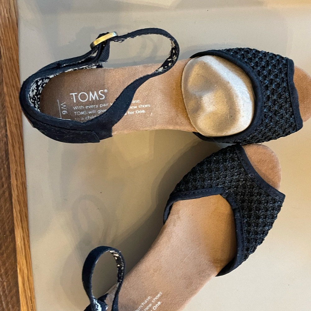 Tom’s wedge sandals.  I don’t believe they have ever been worn.